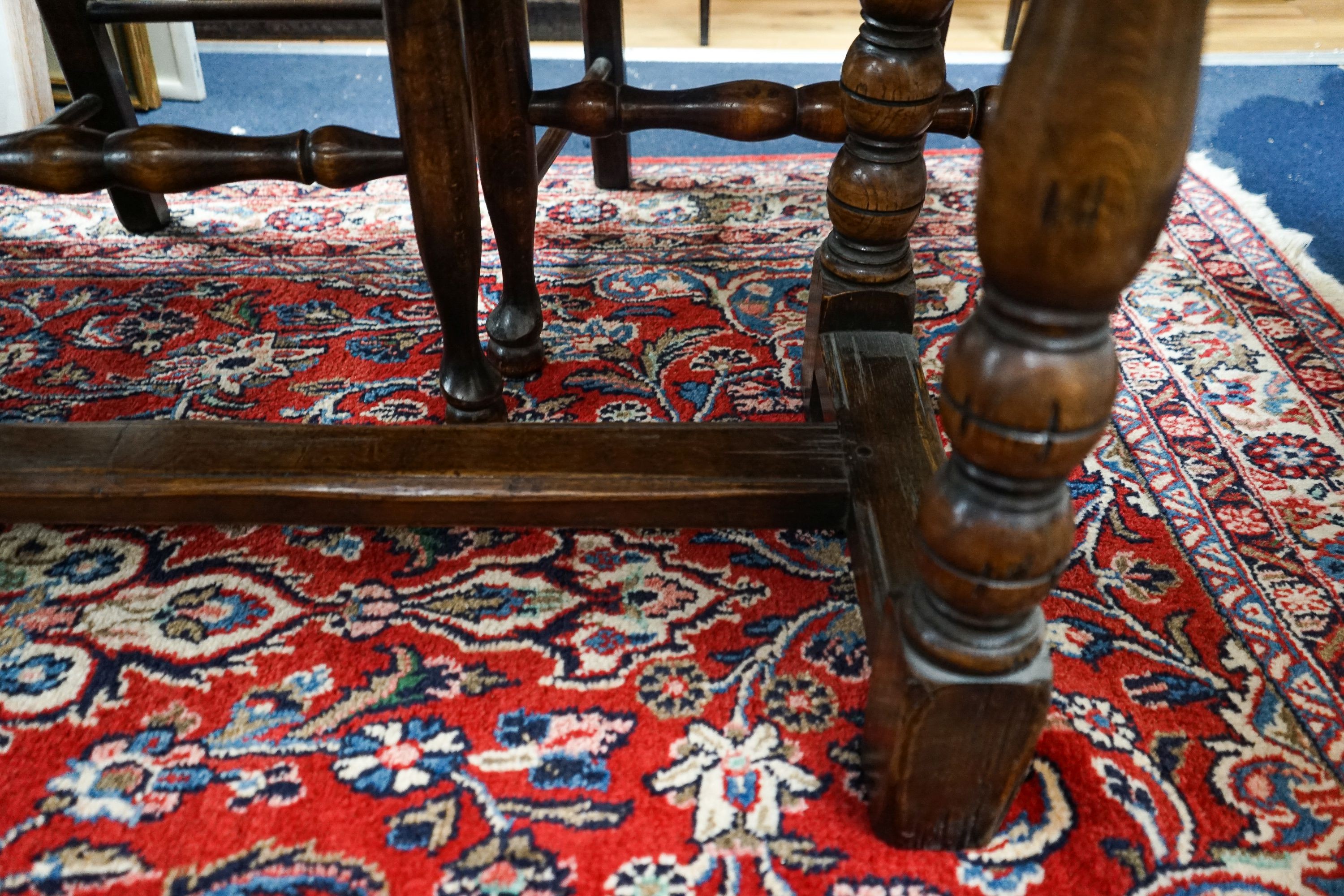 A Titchmarsh & Godwin 18th century style rectangular oak dining table with twin flap folding top, length 170cm extended, depth 99cm, height 74cm